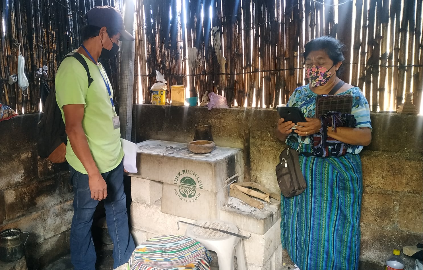 two people with stove